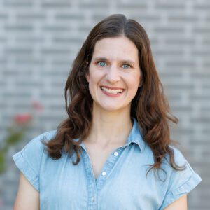 Dr. Rachel Vazquez wearing a light blue top and smiling at the camera